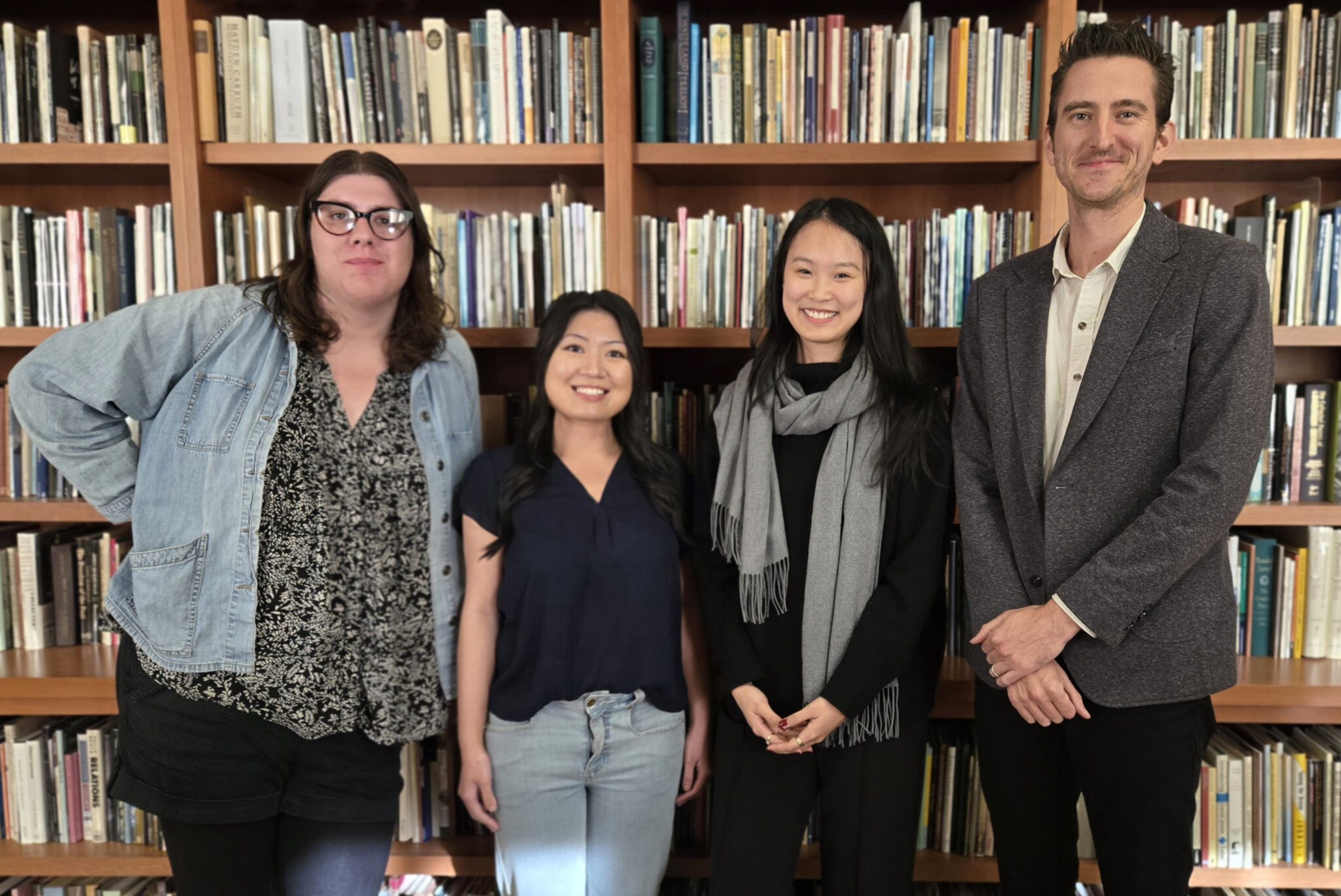 Pictured: Rosalind Shoopmann, Kim Hu and Sunny Xiaoyang Hua with Professor Alex Mazzaferro in the Grace M. Hunt Memorial English Reading Room in Kaplan Hall.