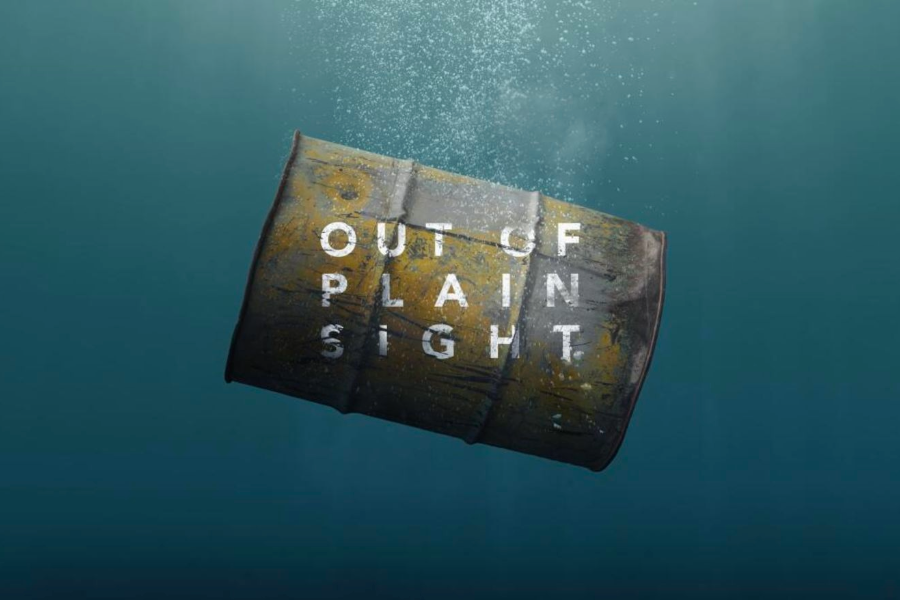 Image of barrel floating in deep water, with title of event across the barrel's front.